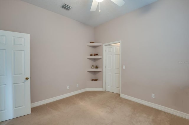 carpeted empty room with ceiling fan