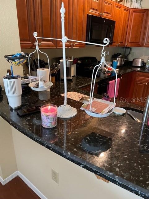 kitchen with dark stone countertops