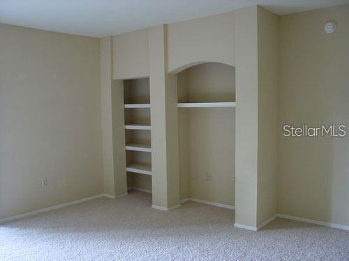 unfurnished bedroom with light colored carpet