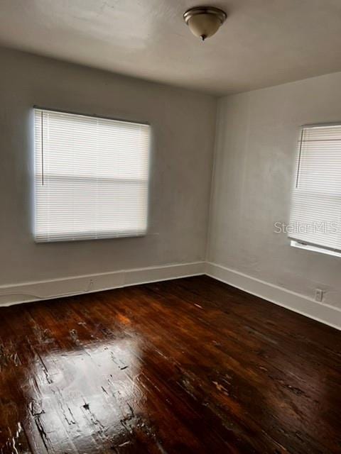 empty room featuring dark hardwood / wood-style floors