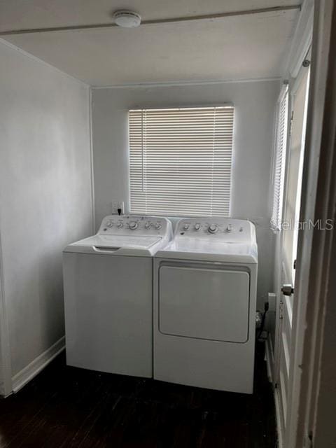 washroom featuring dark hardwood / wood-style flooring and independent washer and dryer