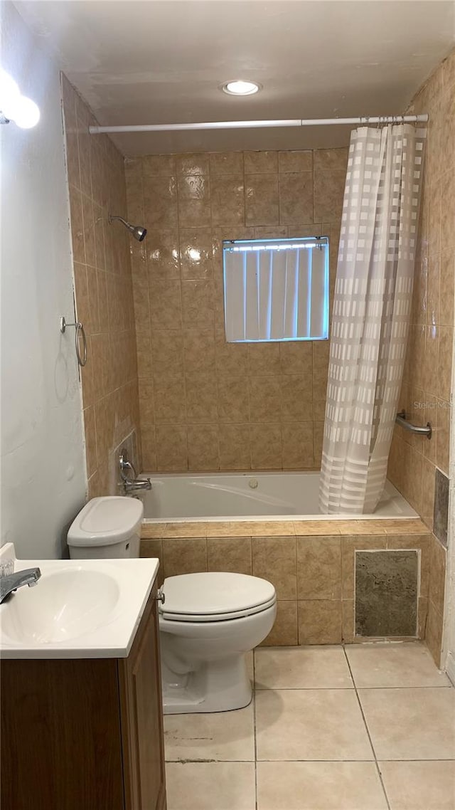 full bathroom featuring vanity, toilet, shower / bathtub combination with curtain, and tile patterned flooring