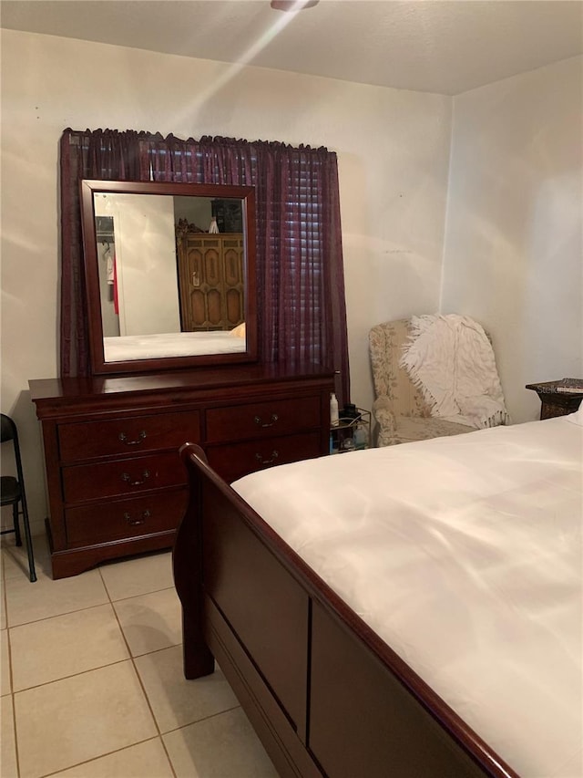 bedroom featuring light tile patterned floors