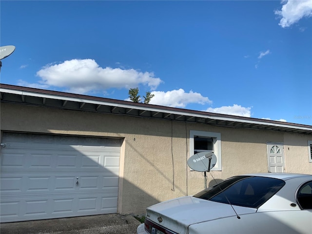 view of property exterior featuring a garage