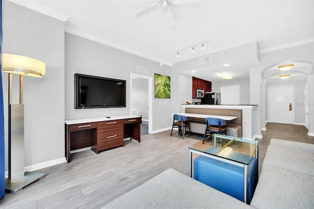 living room with ceiling fan, light hardwood / wood-style flooring, rail lighting, and ornamental molding