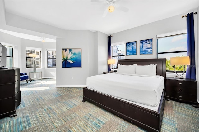 carpeted bedroom featuring ceiling fan