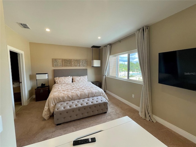 bedroom with light colored carpet