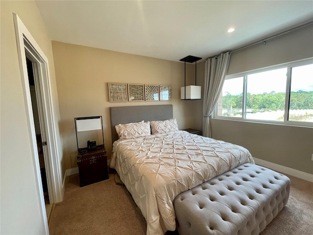 bedroom featuring baseboards and carpet flooring
