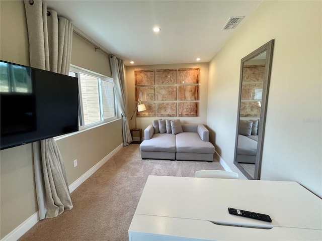 living area with light carpet, visible vents, recessed lighting, and baseboards