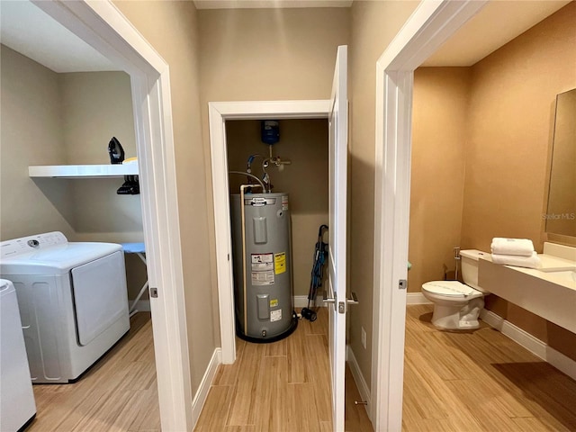 interior space with electric water heater and independent washer and dryer