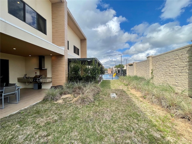 view of yard featuring fence
