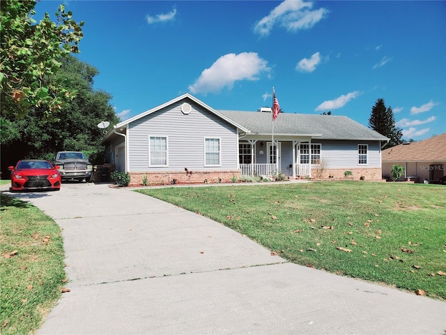 ranch-style home with covered porch and a front lawn