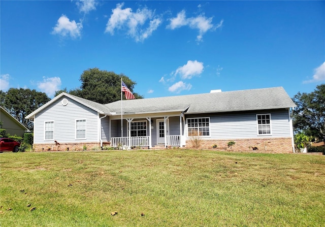 single story home with a front lawn and covered porch