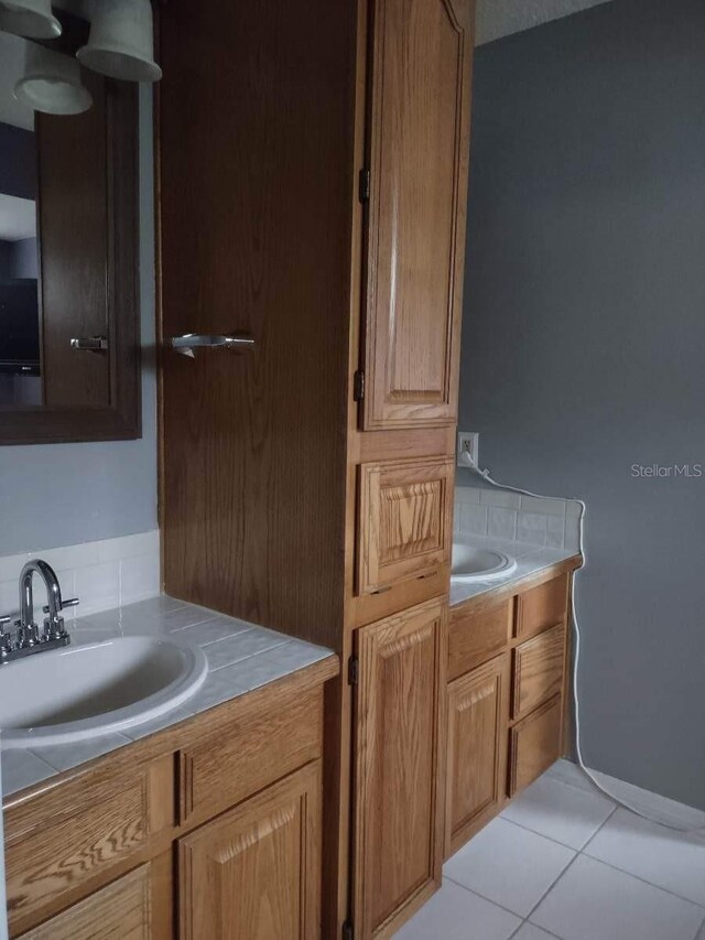 bathroom featuring vanity and tile flooring