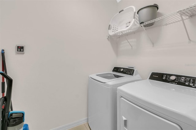 washroom with washing machine and clothes dryer