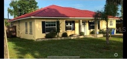 bungalow-style house with a front yard