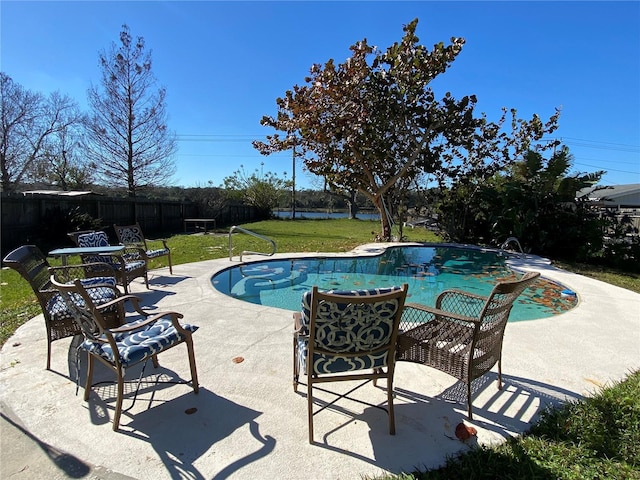 view of pool featuring a patio area and a lawn