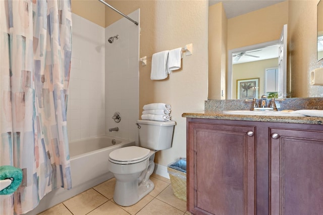 full bathroom featuring tile patterned flooring, toilet, vanity, and shower / bath combo with shower curtain