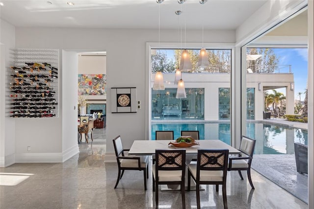 tiled dining room with a wealth of natural light