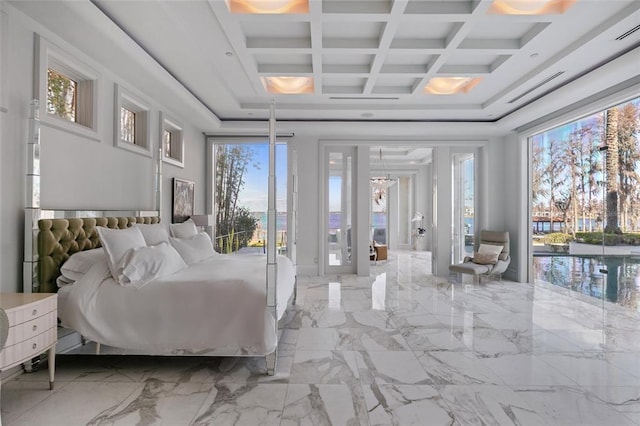 tiled bedroom with coffered ceiling, a chandelier, multiple windows, and beamed ceiling