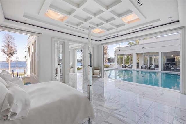 interior space with french doors, coffered ceiling, and beamed ceiling