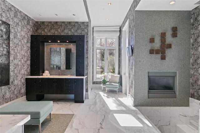 bathroom featuring tile walls, vanity, and tile flooring