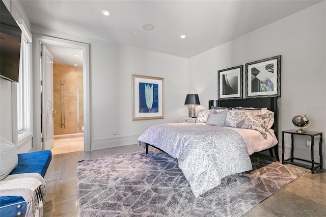 bedroom featuring tile flooring and ensuite bath