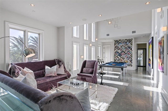 living room featuring tile floors, billiards, and a high ceiling