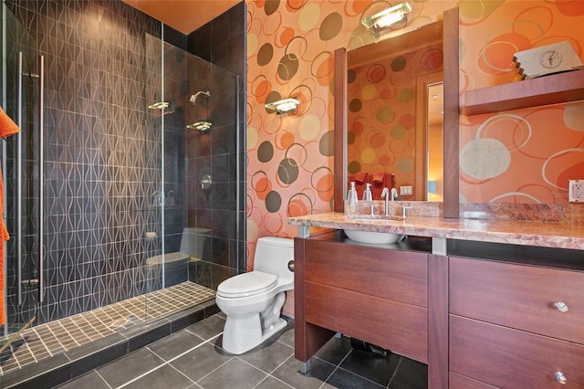 bathroom featuring walk in shower, tile floors, large vanity, and toilet