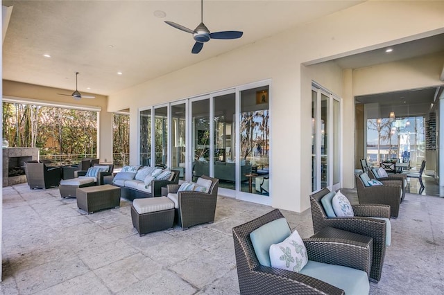 view of patio featuring an outdoor hangout area and ceiling fan