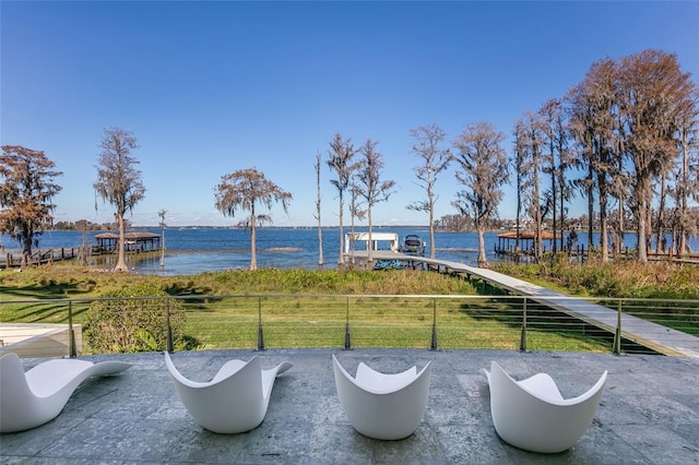 view of patio with a water view