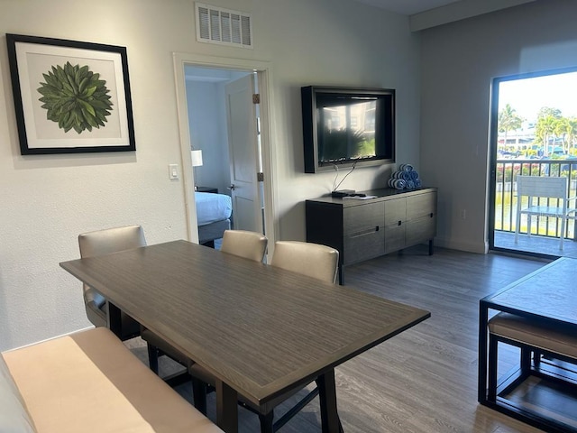 dining space featuring hardwood / wood-style floors