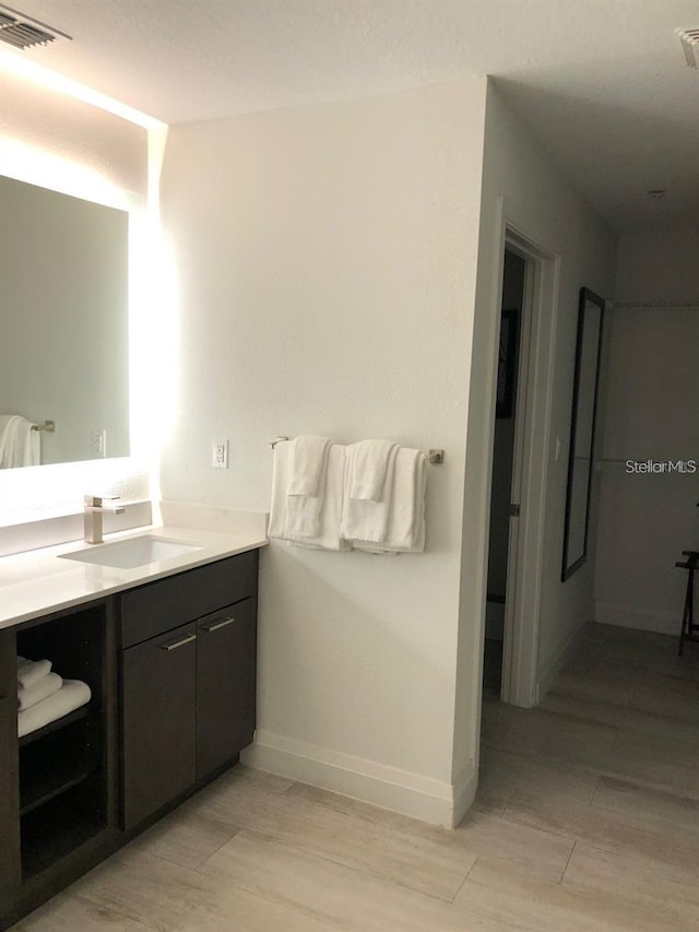 bathroom featuring vanity and wood-type flooring