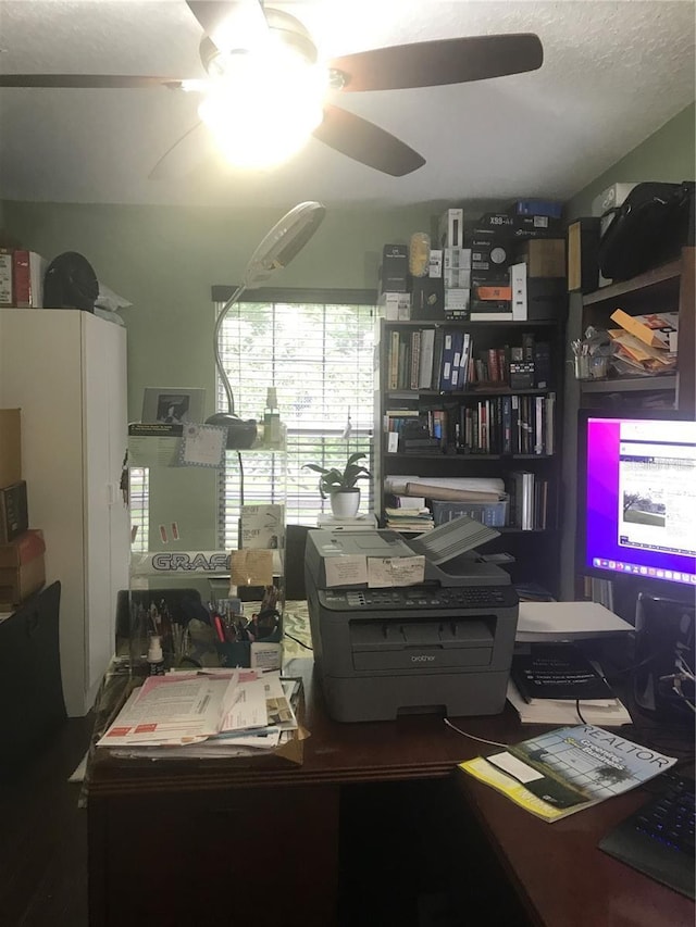 office area with ceiling fan and a textured ceiling