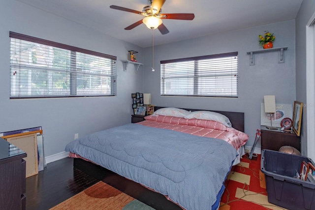 bedroom with ceiling fan and hardwood / wood-style floors