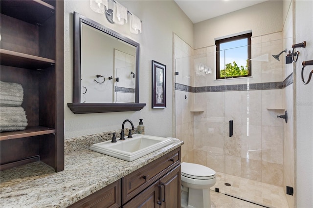 bathroom with walk in shower, toilet, and oversized vanity