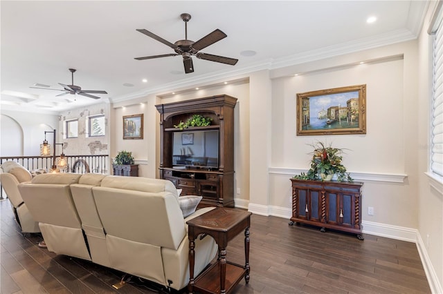 living room with ornamental molding, ceiling fan, and dark hardwood / wood-style floors