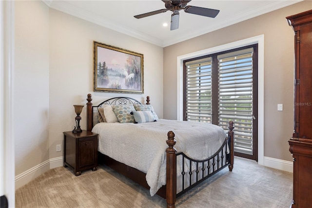 carpeted bedroom with ornamental molding and ceiling fan