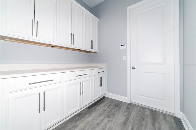 laundry room with light hardwood / wood-style floors