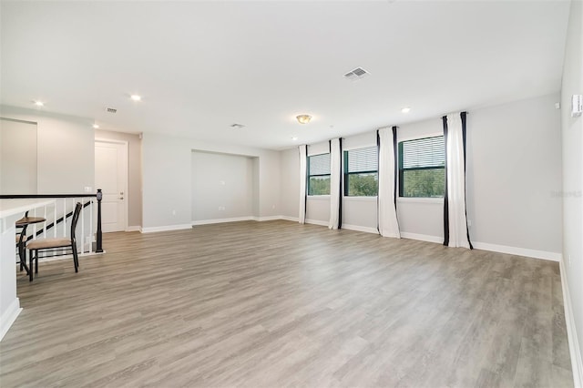 unfurnished room with light hardwood / wood-style floors