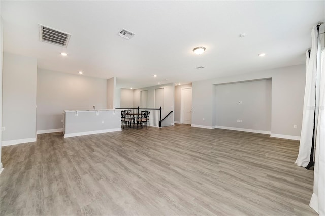 unfurnished living room with light hardwood / wood-style floors