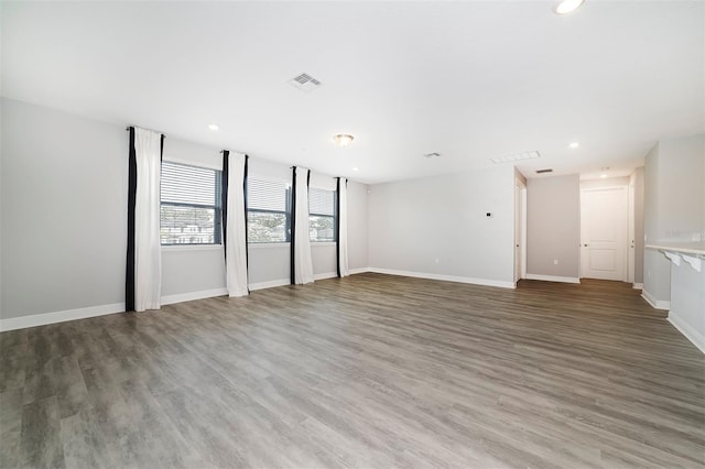 empty room with dark wood-type flooring