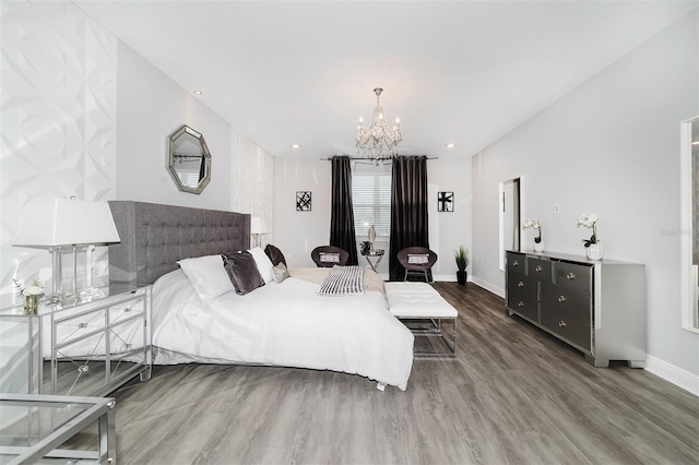 bedroom featuring a notable chandelier and hardwood / wood-style flooring