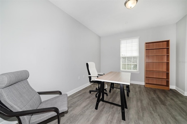 office area with wood-type flooring and vaulted ceiling