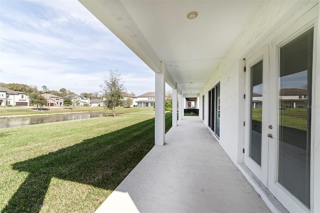 view of patio / terrace with a water view