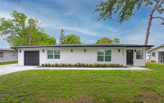 ranch-style home featuring a garage and a front yard