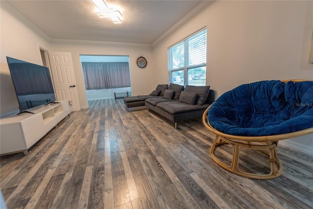 living room with dark wood-type flooring and ornamental molding