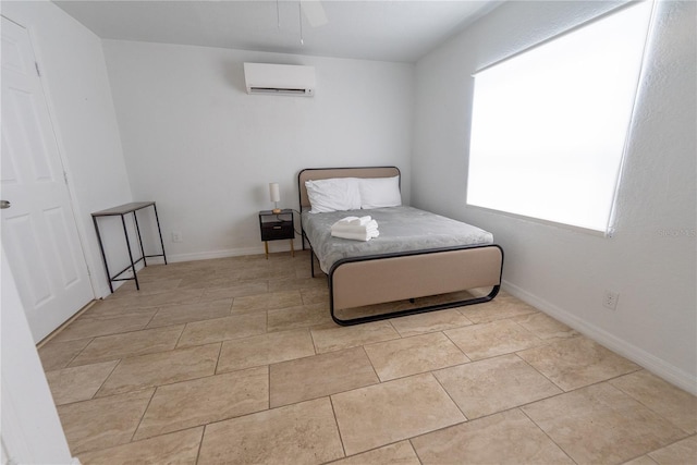 tiled bedroom featuring a wall mounted air conditioner and ceiling fan