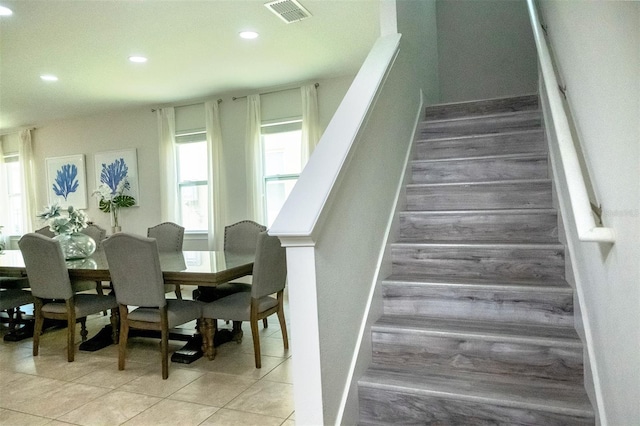 staircase with light tile floors