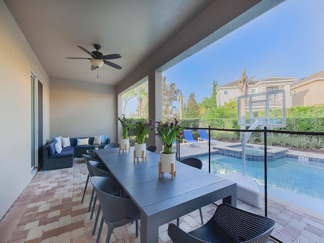 view of patio with a pool with hot tub, an outdoor living space, and ceiling fan